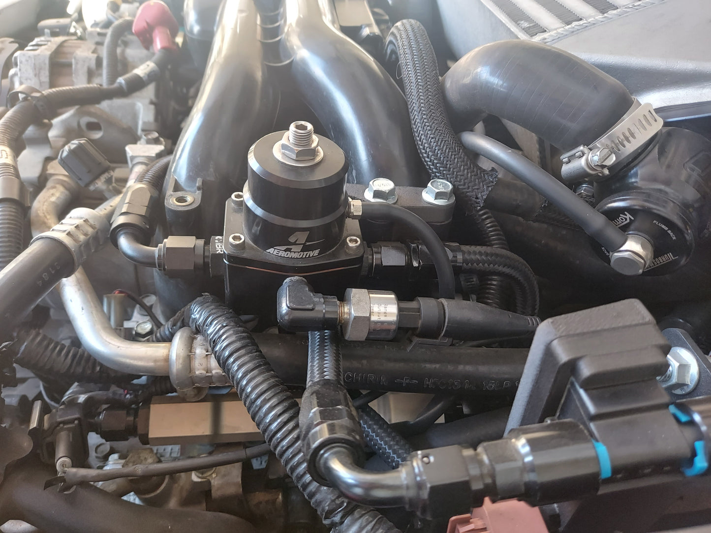 Subaru Fuel Pressure Regulator Mount Installed on Car Front View