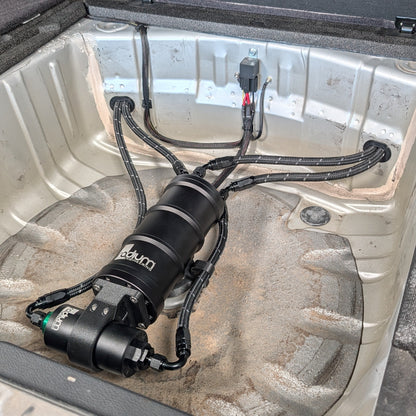Radium Surge Tank and Fuel Filter Mounted in the Spare Tire Well of a Subaru Side View